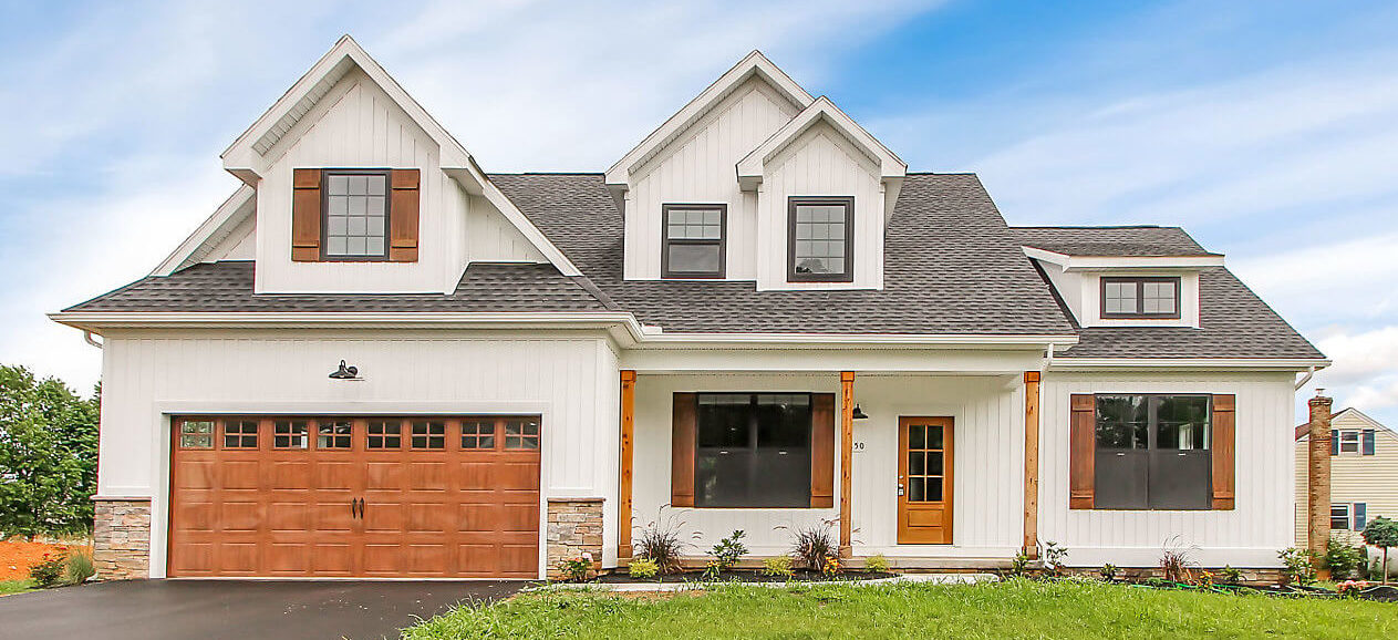 a white house with wood stained accents
