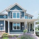 large blue house with large porch