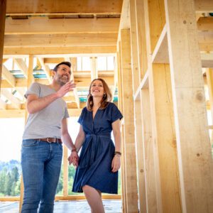 A couple visiting the construction of their dream home.